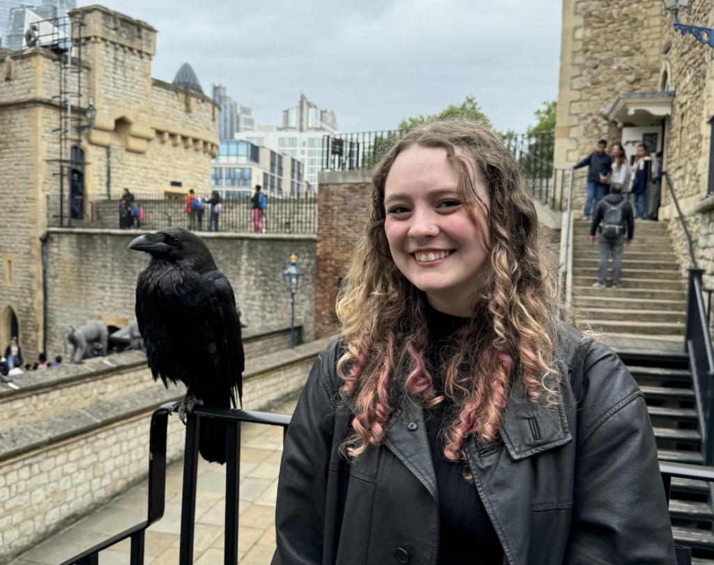 Jay Grummel (interview respondent) with a bird (black, probably a raven but maybe a crow)