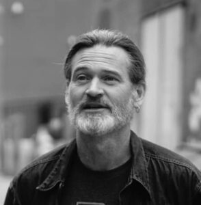 Phot of Dave Essinger, bearded white man with long hair