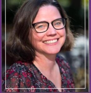 Photo of Jonie McIntire, white woman with dark hair and glasses